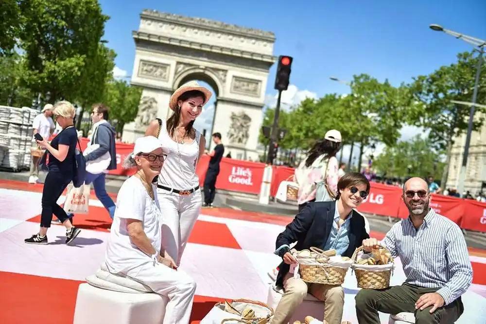 Paris hosted a massive picnic for over 4,000 people on the iconic Champs-Élysées, aiming to attract local customers in the lead-up to the Olympics